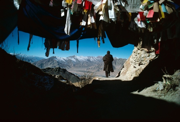 A pilgrim walks round Ganden monastery as a sign of devotion (Tibet)