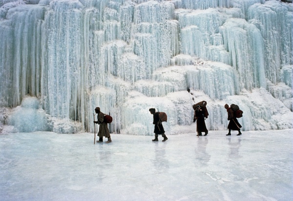 The cold during winter has frozen this waterfall falling into the river in Zanskar (Indian Himalaya)